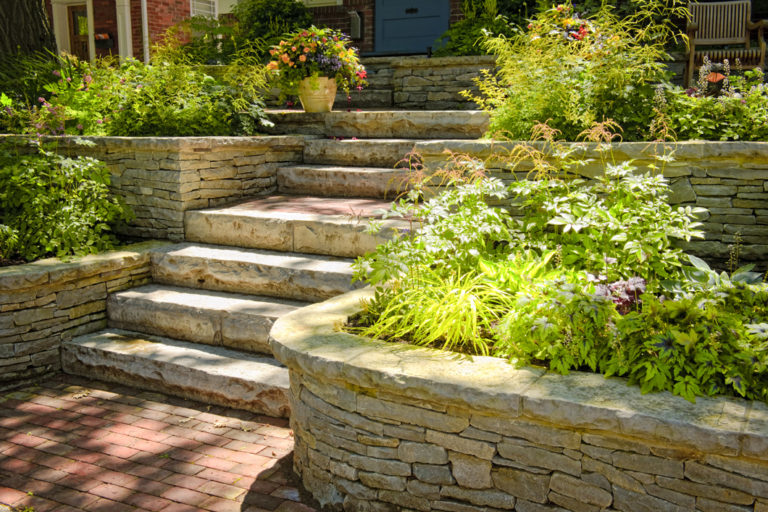 Tiered stone retaining walls with steps